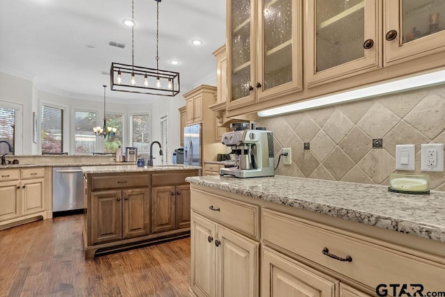 kitchen featuring dark hardwood / wood-style flooring, backsplash, stainless steel appliances, crown molding, and sink