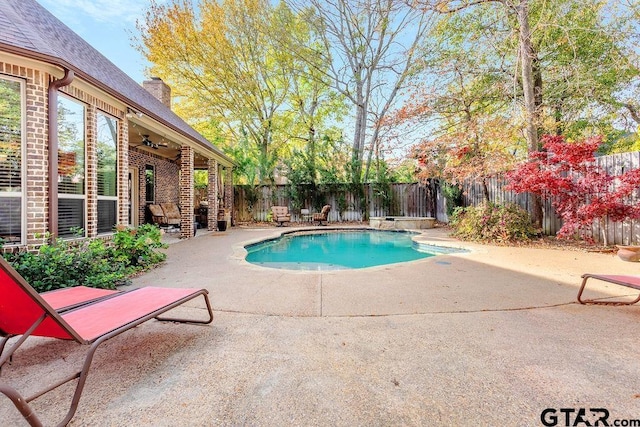 view of pool featuring ceiling fan and a patio area