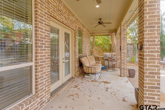 view of patio with french doors and ceiling fan