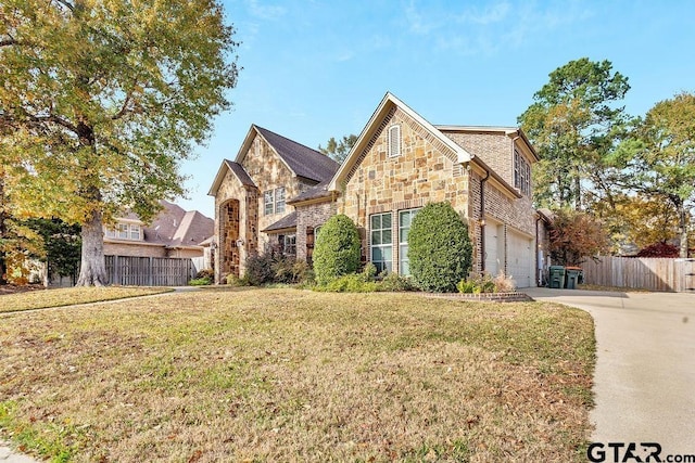 front facade with a garage and a front lawn