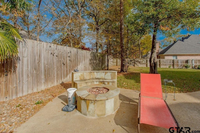 view of patio / terrace featuring an outdoor fire pit