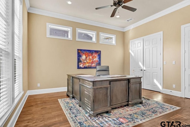 office area featuring ceiling fan, ornamental molding, and light wood-type flooring