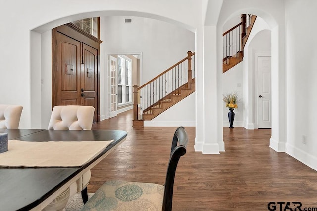 entrance foyer with dark hardwood / wood-style floors