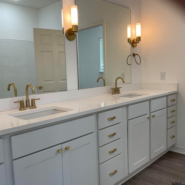 bathroom with vanity and hardwood / wood-style flooring