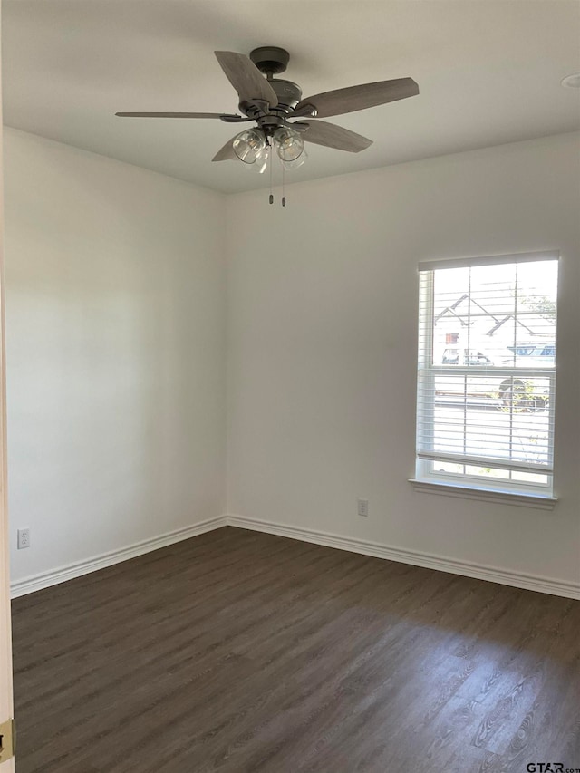 unfurnished room featuring ceiling fan and dark hardwood / wood-style flooring