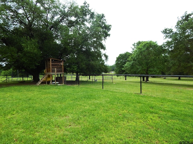 view of yard featuring a playground and a rural view