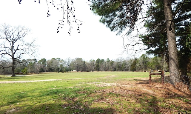 view of property's community featuring a lawn