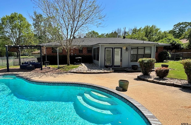 view of swimming pool with a pergola, a fenced in pool, fence, and a patio area