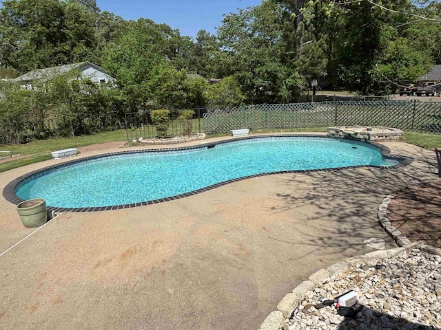 view of pool featuring a fenced in pool, a patio, and fence