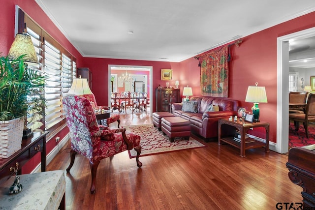 living room with crown molding and hardwood / wood-style floors