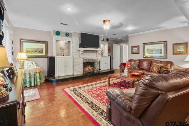 living room featuring a fireplace, crown molding, and parquet flooring