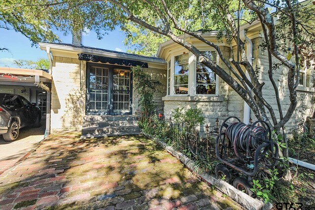 1719 S Chilton Ave, Tyler, TX 75701 - view of side of home featuring stone siding