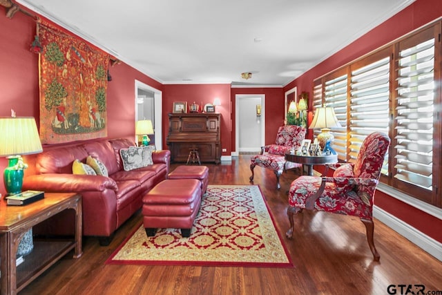 living room with dark hardwood / wood-style floors and ornamental molding