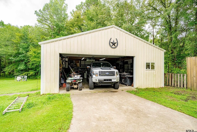 garage featuring a lawn