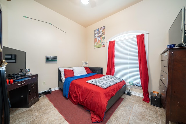 tiled bedroom with ceiling fan