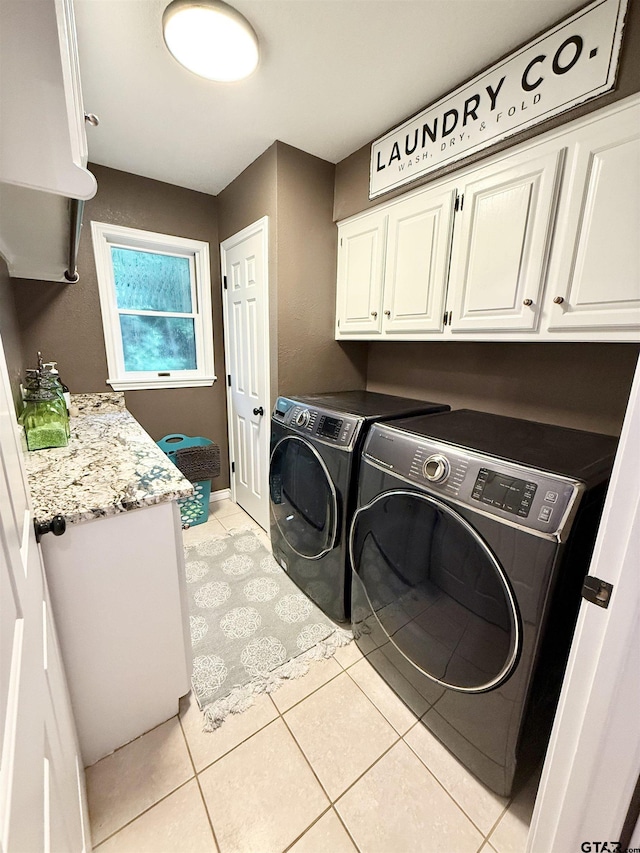 18872 Big Timber Rd, Tyler, TX 75703 - washroom with cabinet space, independent washer and dryer, and light tile patterned floors