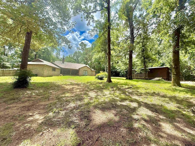 18872 Big Timber Rd, Tyler, TX 75703 - view of green lawn with view of wooded area