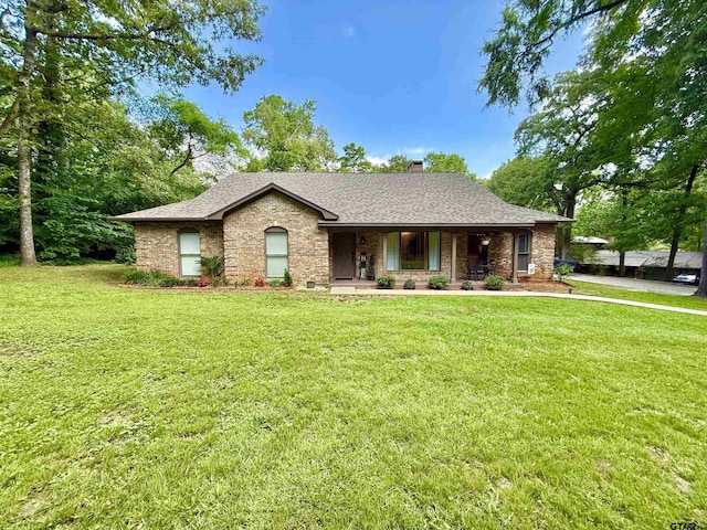 18872 Big Timber Rd, Tyler, TX 75703 - view of front facade featuring a porch, a front lawn, and a shingled roof