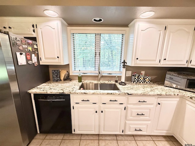 18872 Big Timber Rd, Tyler, TX 75703 - kitchen with dishwasher, freestanding refrigerator, light tile patterned flooring, and light stone counters