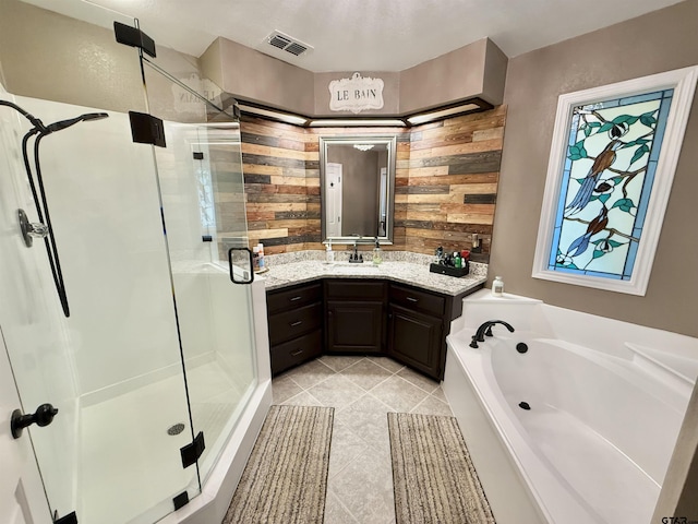 18872 Big Timber Rd, Tyler, TX 75703 - bathroom with a stall shower, vanity, a bath, tile patterned floors, and wooden walls
