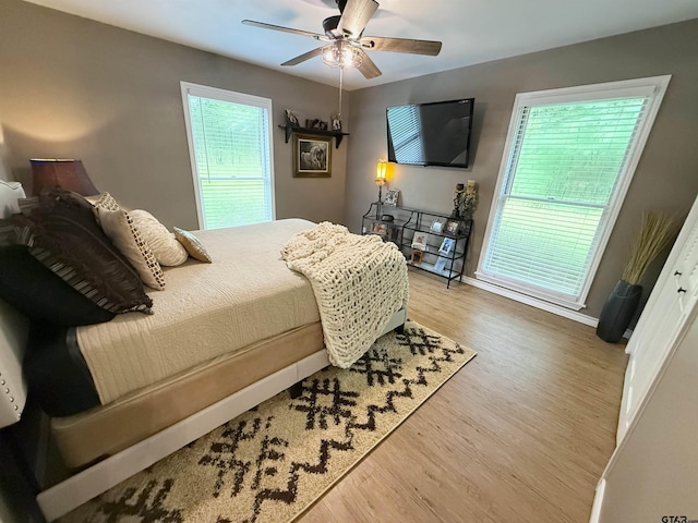 18872 Big Timber Rd, Tyler, TX 75703 - bedroom featuring wood finished floors, multiple windows, and ceiling fan