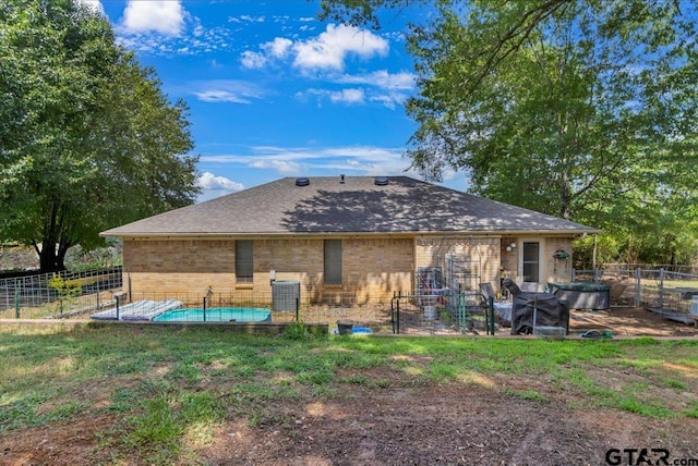3121 S Robertson Ave, Tyler, TX 75701 - rear view of property featuring brick siding and roof with shingles