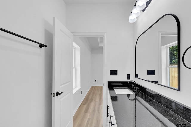 bathroom with vanity and hardwood / wood-style floors