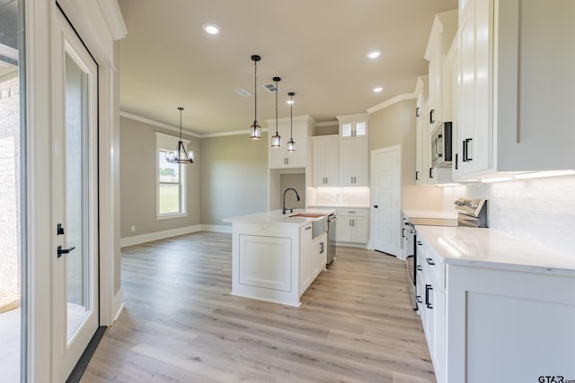 kitchen featuring crown molding, light wood-style floors, stainless steel microwave, range with electric stovetop, and decorative backsplash