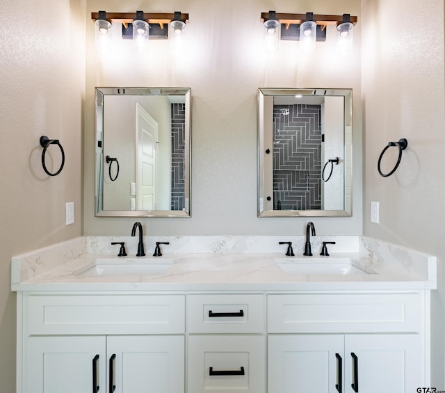 bathroom featuring double vanity and a sink