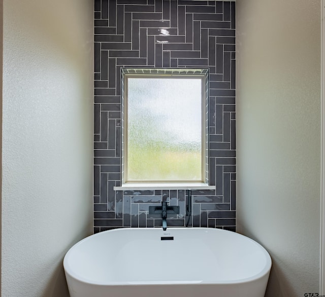 full bathroom with a soaking tub