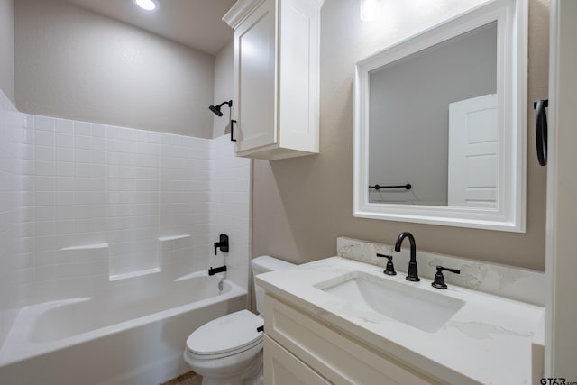 bathroom with shower / bath combination, vanity, and toilet