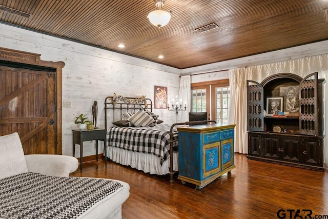 bedroom featuring dark hardwood / wood-style floors, wood walls, wood ceiling, and french doors