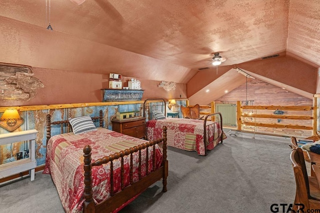 bedroom featuring carpet, ceiling fan, a textured ceiling, and vaulted ceiling