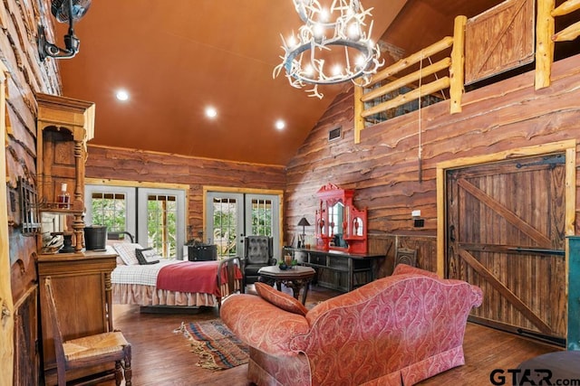 bedroom with rustic walls, french doors, high vaulted ceiling, and dark wood-type flooring