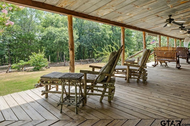 wooden deck featuring ceiling fan