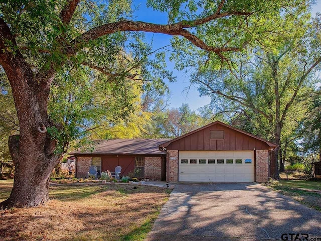 single story home featuring a garage