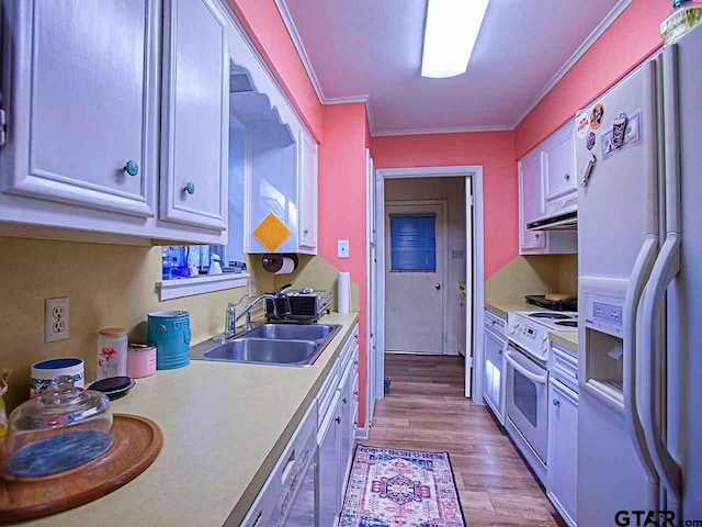 kitchen with light hardwood / wood-style floors, sink, white appliances, crown molding, and white cabinets