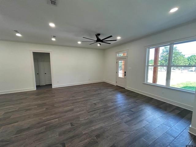 empty room featuring ceiling fan and dark hardwood / wood-style floors