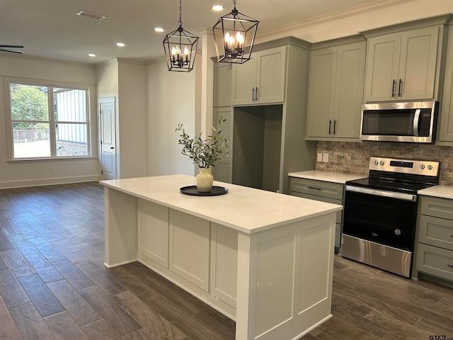 kitchen with gray cabinets, stainless steel appliances, and dark hardwood / wood-style floors