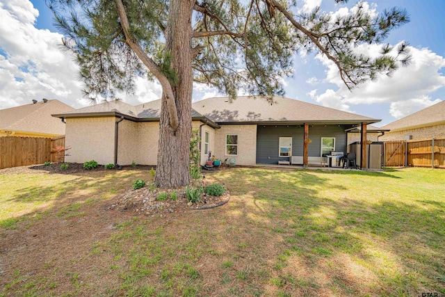 107 Hay Meadow Dr, Winona, TX 75792 - rear view of house with a patio area, brick siding, and a gate