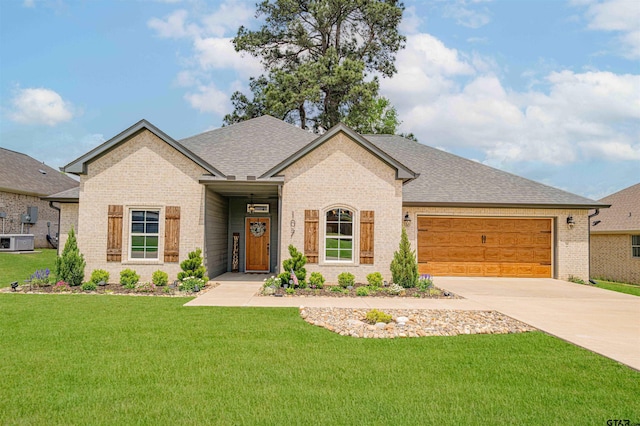 107 Hay Meadow Dr, Winona, TX 75792 - view of front of property featuring brick siding, a front yard, an attached garage, concrete driveway, and a shingled roof