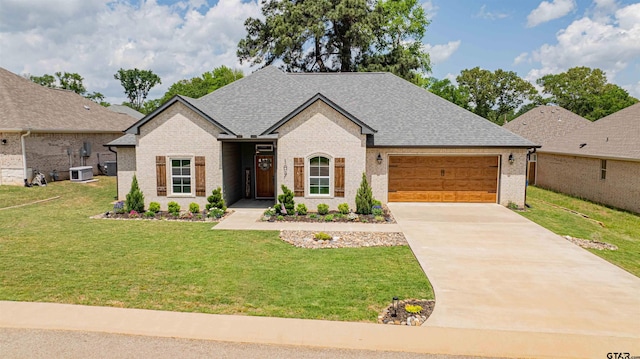 107 Hay Meadow Dr, Winona, TX 75792 - view of front of property featuring brick siding, a garage, a front lawn, and driveway