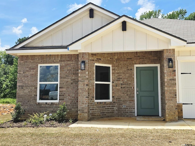 1106 Park Meadows Dr, Whitehouse, TX 75791 - view of front of house featuring board and batten siding, brick siding, and roof with shingles