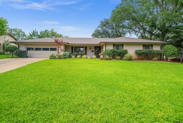 1430 Wavely St, Tyler, TX 75701 - ranch-style home with a garage, a front lawn, brick siding, concrete driveway, and a shingled roof