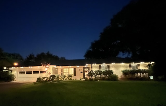 1430 Wavely St, Tyler, TX 75701 - ranch-style house featuring a lawn and a garage