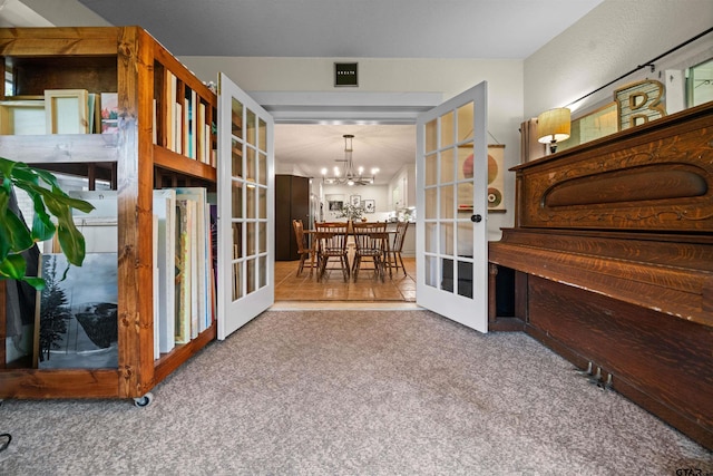 1430 Wavely St, Tyler, TX 75701 - interior space with french doors and a chandelier
