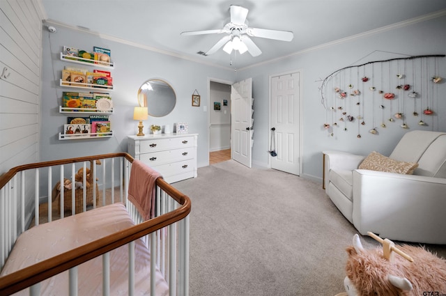 1430 Wavely St, Tyler, TX 75701 - bedroom featuring carpet flooring, crown molding, a nursery area, ceiling fan, and baseboards