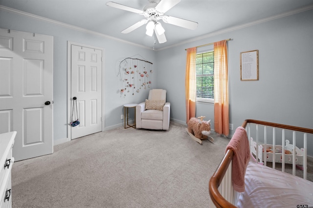1430 Wavely St, Tyler, TX 75701 - bedroom featuring carpet floors, crown molding, a crib, baseboards, and ceiling fan