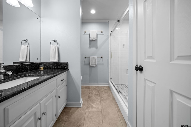 1430 Wavely St, Tyler, TX 75701 - bathroom with vanity, a shower stall, baseboards, tile patterned floors, and crown molding