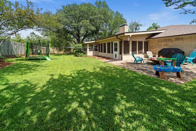1430 Wavely St, Tyler, TX 75701 - view of yard with a sunroom, a patio, and a trampoline
